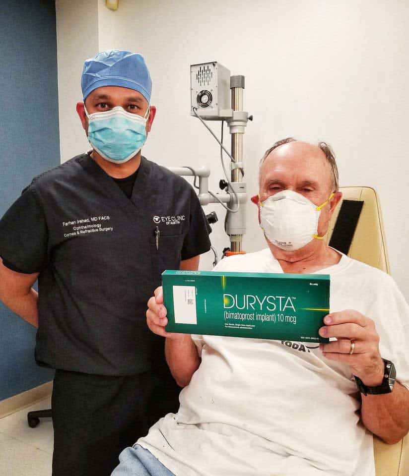 Dr. Irshad with a patient holding a box for Durysta